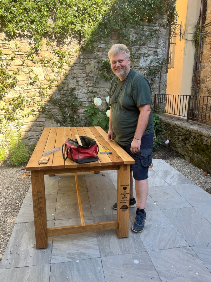 Arpi — Arpad Czimbalmos — at his oak garden table in Cortona